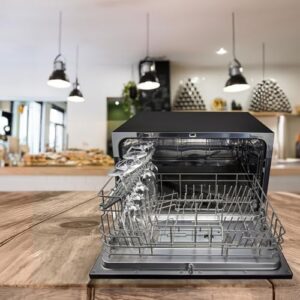 Magic Chef Countertop Portable Dishwasher in Black, showcasing its compact design and electronic controls.