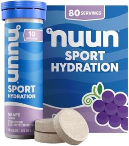 Nuun Sport Electrolyte Tablets dissolving in water with grape flavor, offering hydration with 5 essential electrolytes and only 1g of sugar.